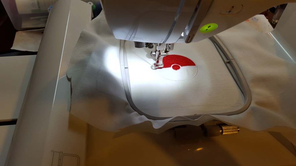 Embroider pokeball on front panel