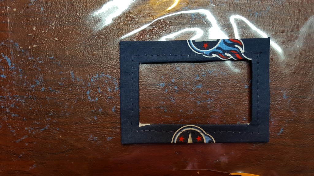 Cut a piece of plastic smaller than the frame.