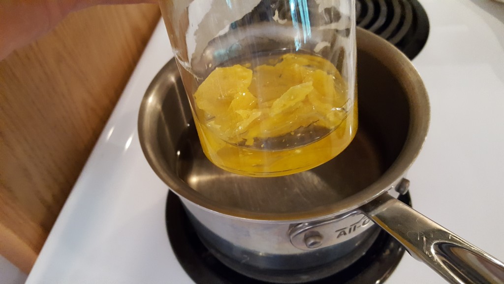 Mix beeswax and almond oil in a jar in hot water bath