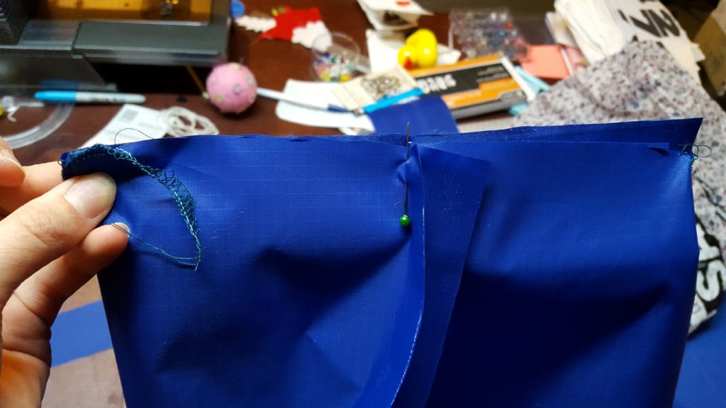 Pin bottom of bag, pull taunt to bottom side of bag to see if sizes match. 