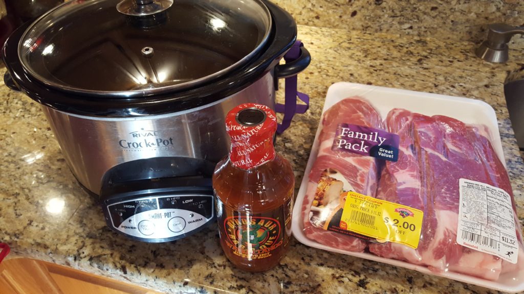 All you need is a jar of bbq sauce, 2 lbs of pork (half what is shown here) and a crock pot! Grand total for pulled pork for 4 is $7 (less if your pork is <$2/lb)