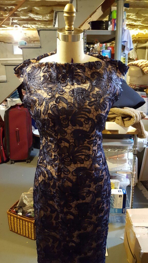 Repinning the shoulders and pinning a new neckline. 