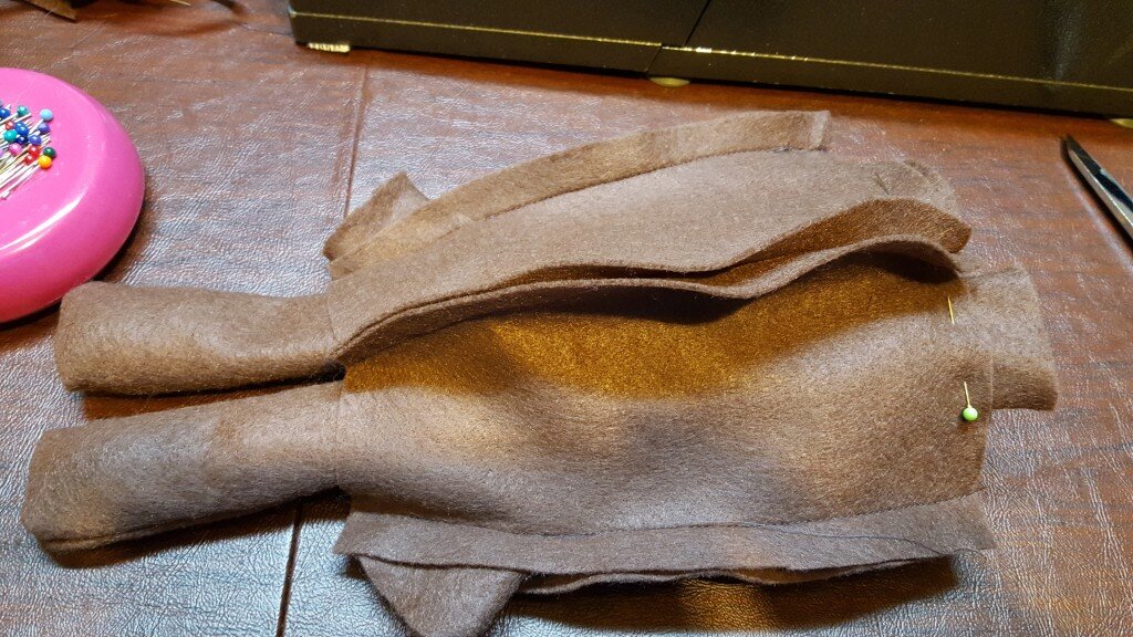 You can see here the legs pinned at center front and the arms sewn into the side seams. 