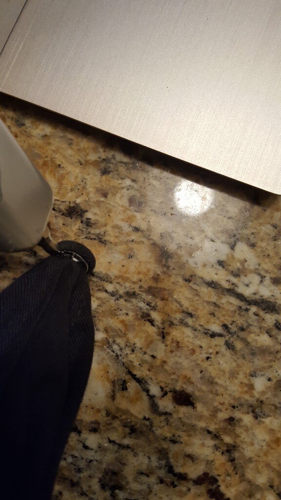 Pry off metal button