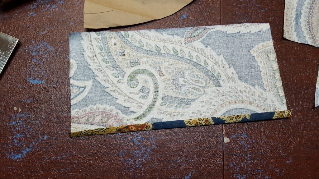 Fold under one side of the pocket. 