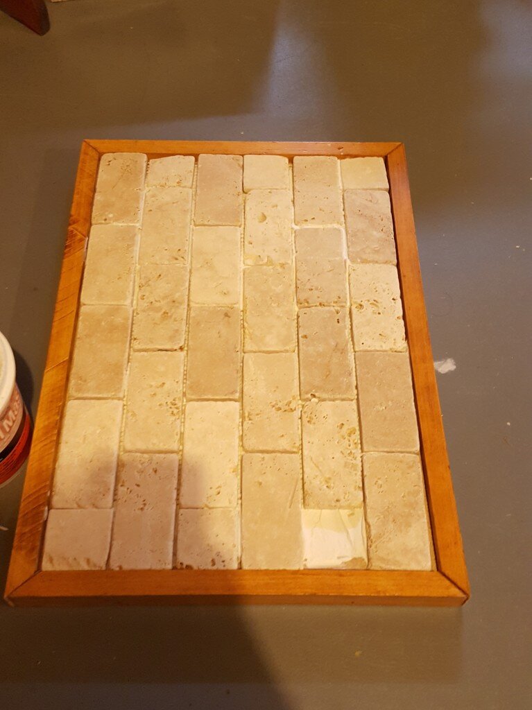 Apply mastic and tiles