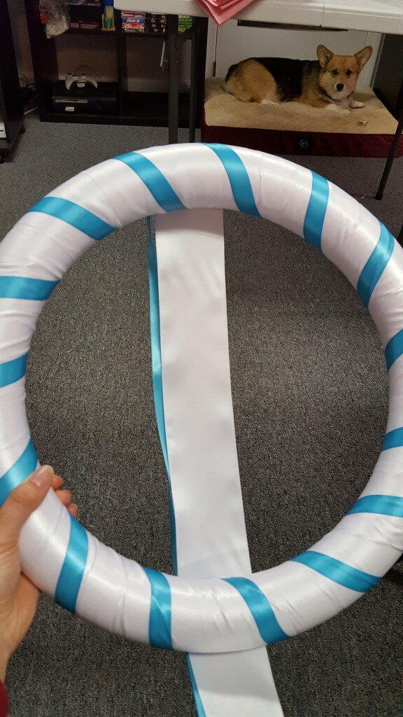 Wrap form with blue ribbon. Make sure corgi approves. 