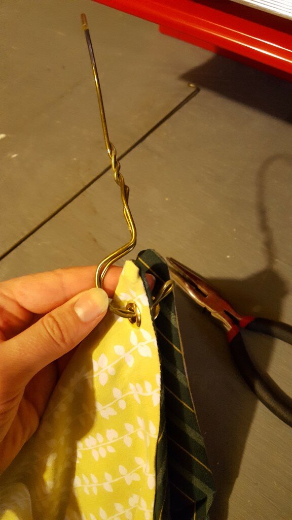 Thread hook through eyelets