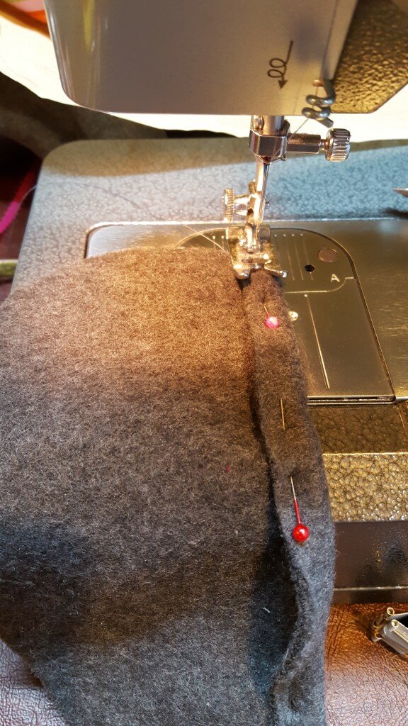 Pin 1/2" on each straight end. Stitch.