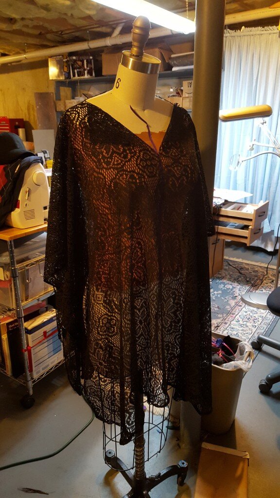 Cut 9 inch slit down the front of the dress to form a "v" neck