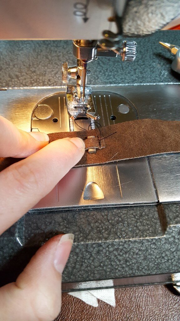 Insert popsicle stick and sew close to end of stick to hold it in place. 