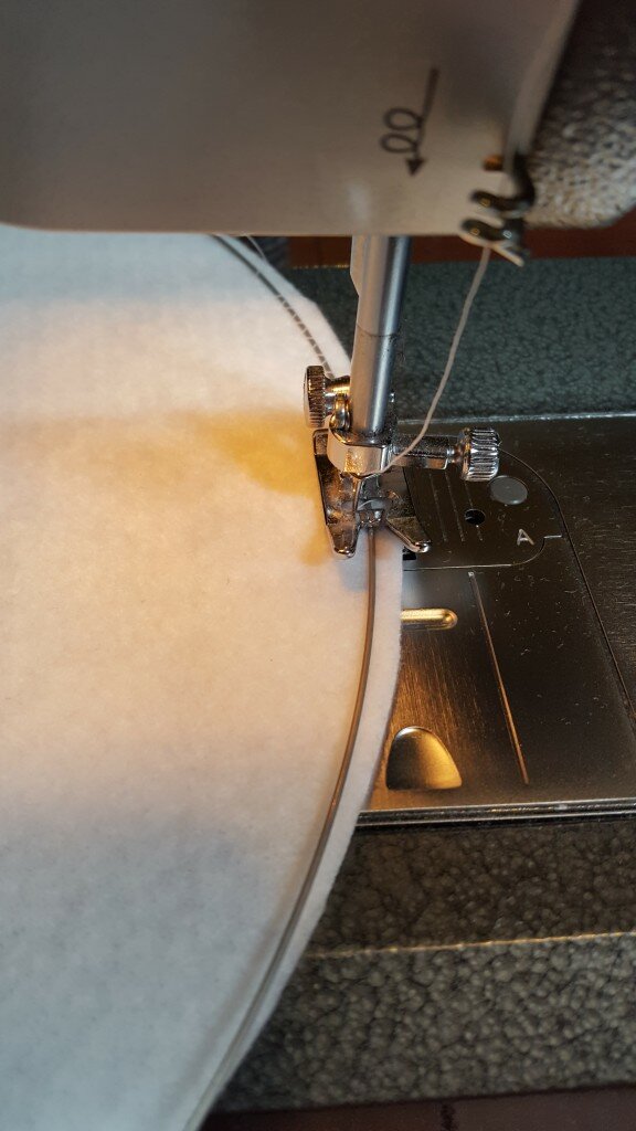 Carefully zigzag stitch the steel spring wire in place on the brim. 