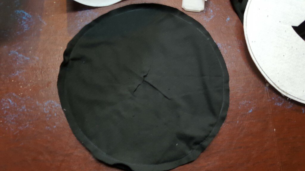 Snip x into your brim. 