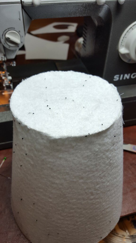 Hand sew Peltex circle to top of Peltex arc.