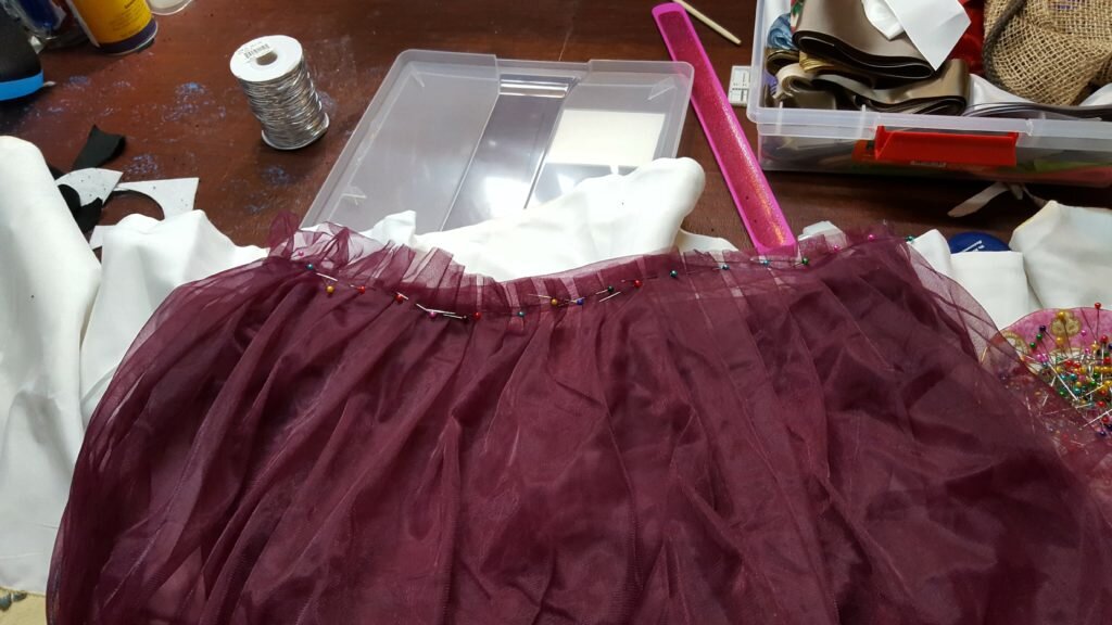 Pleat and pin skirt to bodice. 