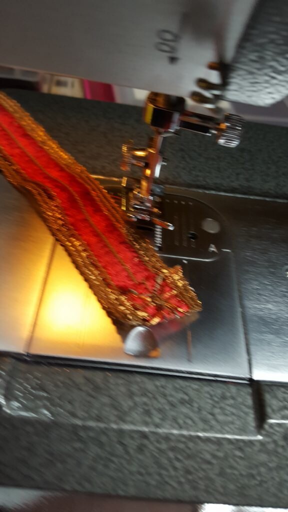 Turn raw ends of band under and stitch in place. 