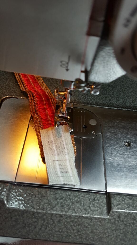 Stitch elastic to inside of band, slightly overlapping the ends. 