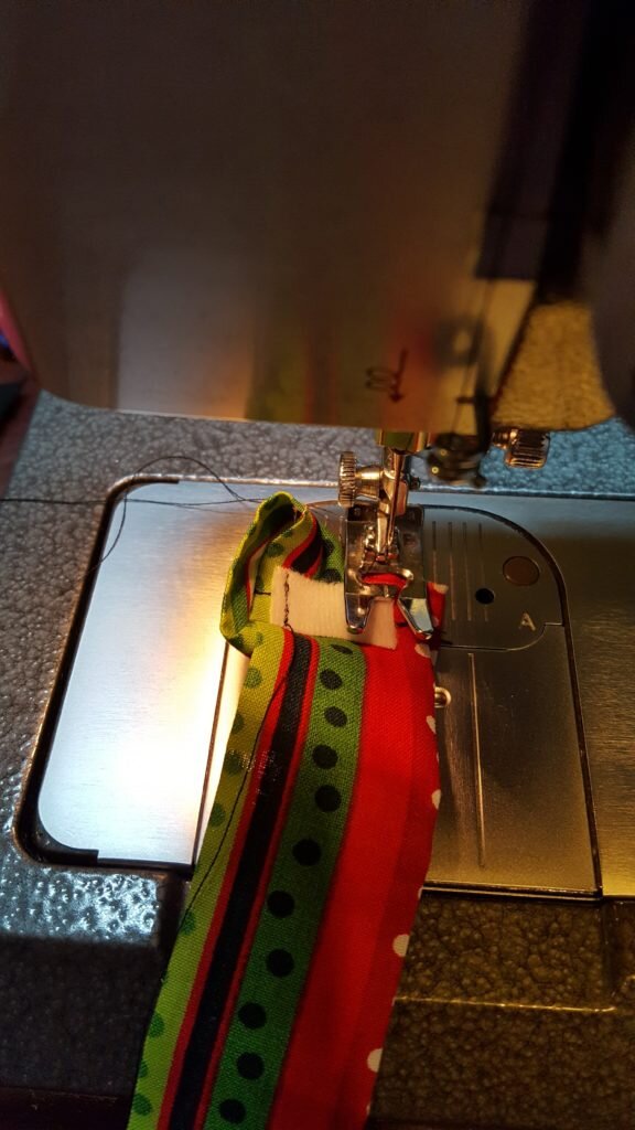 Stitch velcro to loop. 