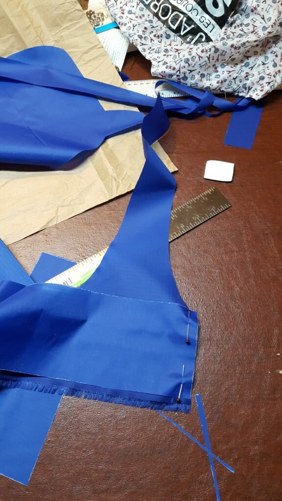 Pin handle reinforcement to side reinforcement, stitch. Repeat for other handle piece and other side. 