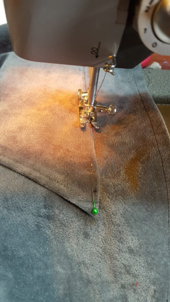 Stitch on the right side of the pocket.
