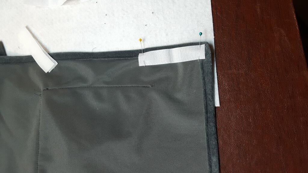 Attach velcro to sides inside carrier. 