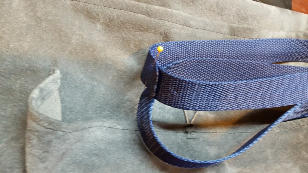 Stitch nylon together. Fold loop in half, and mark the center on both sides. 
