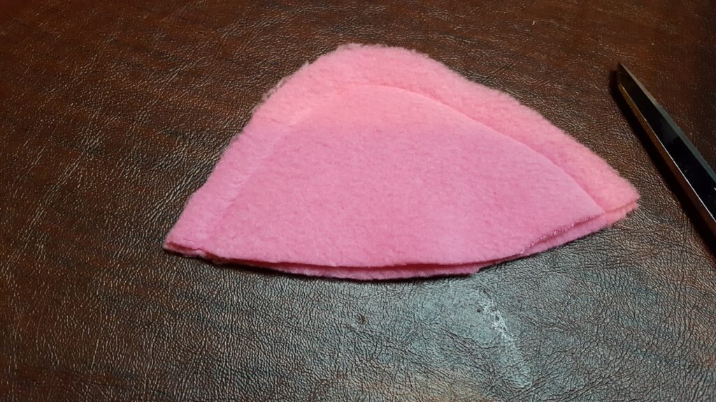 Stitch ear along edge and trim.