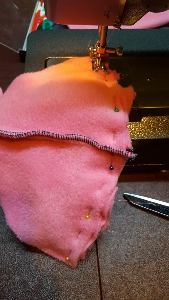 Pin and stitch top, bottom and ears of hat together. 